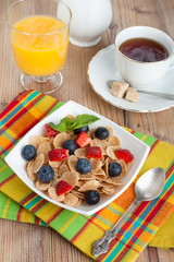 delicious breakfast with orange juice, coffee and muesli with be