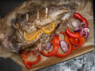 Overhead shot of grilled fish with vegetables.