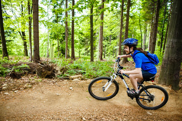 Fototapeta na wymiar Healthy lifestyle - teenage girl cycling 