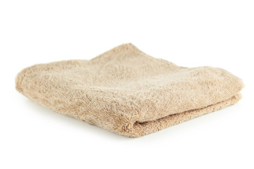 Fototapeta na wymiar Beige towel isolated on white
