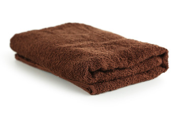 Fototapeta na wymiar Brown towel isolated on white