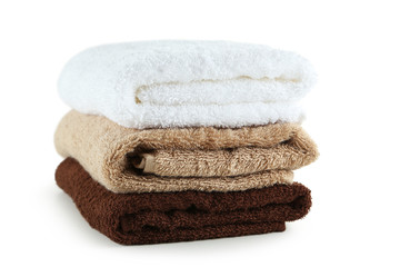 Fototapeta na wymiar Brown, beige and white towel isolated on white