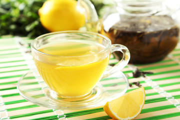 Green tea in cup and teapot 