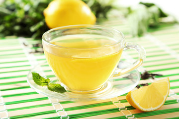 Green tea in cup and teapot 