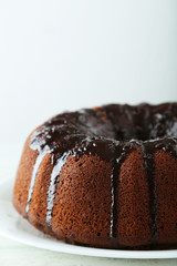 Chocolate bundt cake on wooden background