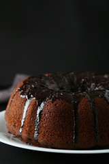 Chocolate bundt cake on wooden background