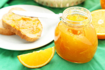 Obraz na płótnie Canvas Orange juice in bottle and orange in basket 