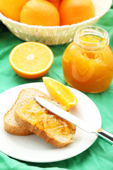 Naklejka na ściany i meble Orange juice in bottle and orange in basket 