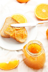 Orange juice in bottle and orange in basket 