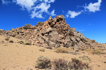 desert landscape, rocks , sand and blue sky,