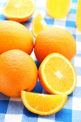 Ripe oranges on blue napkin