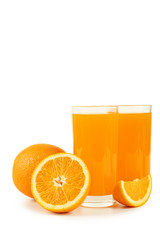 Glass of fresh orange juice on wooden background