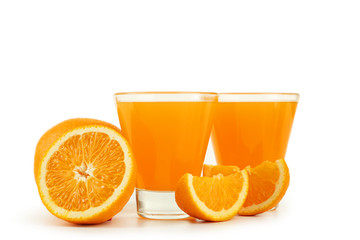Glass of fresh orange juice on wooden background