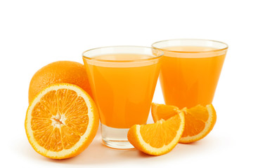 Glass of fresh orange juice on wooden background