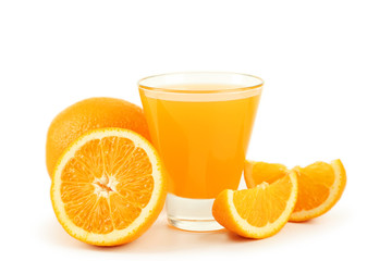 Glass of fresh orange juice on wooden background