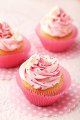 Tasty cupcake on pink background