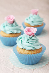 Tasty cupcake on pink background