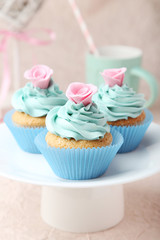 Tasty cupcake on pink background