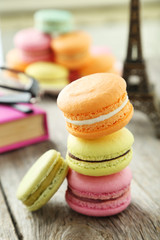 French colorful macarons on grey wooden background
