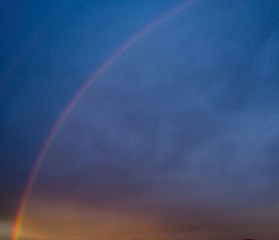 Rainbow during an approaching storm, dramatic, dark clouds