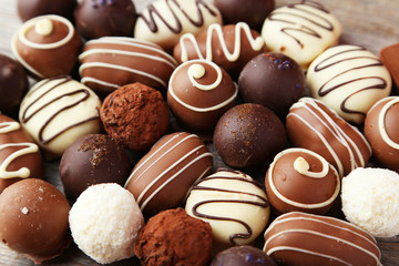 Brown sugar in spoon and bowl on wooden background