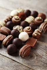 Chocolates on grey wooden background