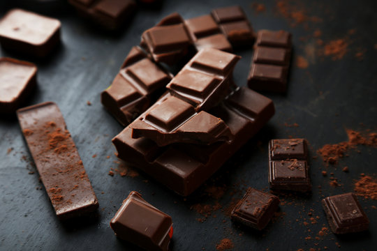 Chocolate plates on black background