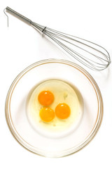 Whisk for whipping and eggs in bowl