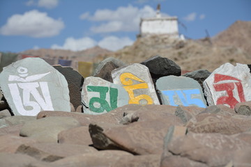 Mani stones on mani wall in Leh, Ladakh, India