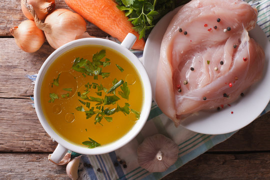 Chicken broth and ingredients. top view closeup, homemade
