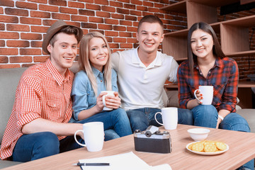 Happy friends in a cafe