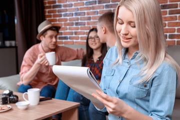 Girl writing her notebook in cafe 