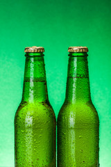 Wet green beer bottles