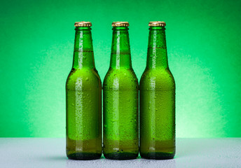 Three wet blank beer bottles