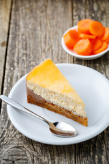 Sweet slice of carrot cake on white plate.