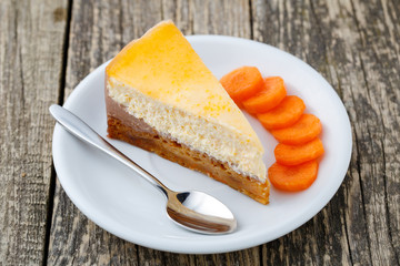 Slice of carrot cake on white plate.