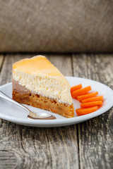 Sweet slice of carrot cake on white plate.