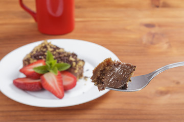 Eating chocolate cake