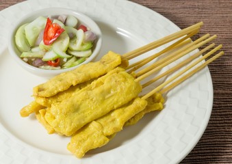 Delicious Grilled Pork Satay Served with Cucumber Salad