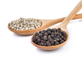 peppercorn in the wooden spoon on white background