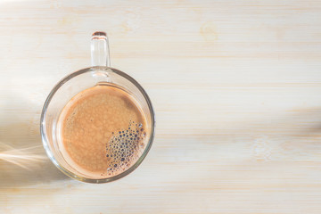cup of fresh espresso on table, view from above