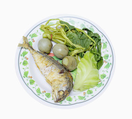 fried mackerel with shrimp paste sauce in dish isolated on white