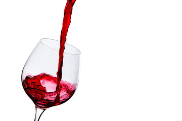 red wine poured into a glass on a white background