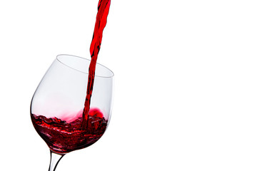 red wine poured into a glass on a white background
