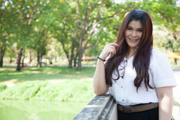 Female student smiling happily.