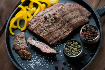 Medium grilled beef barbecue steak with bell pepper and spices