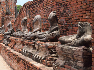 Fototapeta na wymiar Buddha with old brick wall Ayutthaya, Thailand