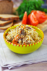 pilaf with lamb in a green piala