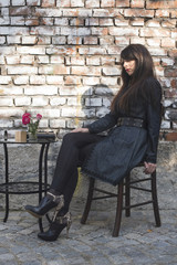 Woman sitting on a chair in coffee shop