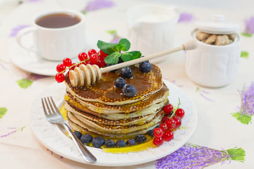 Pancake with honey and berries